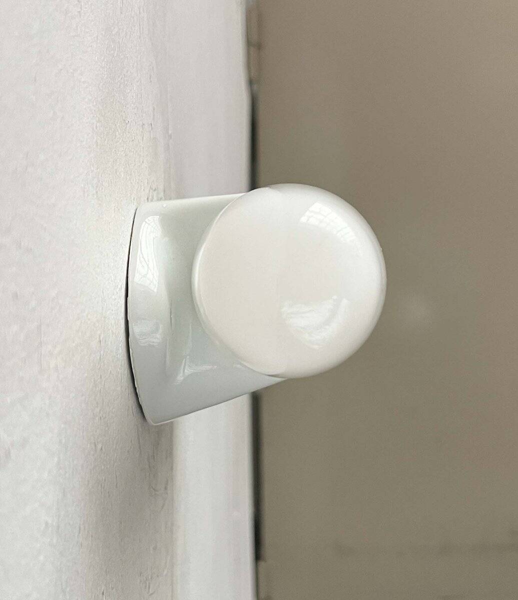 6068 mirror applique in mid-century modern style by Wilhelm Wagenfeld for Lindner, 1950s.