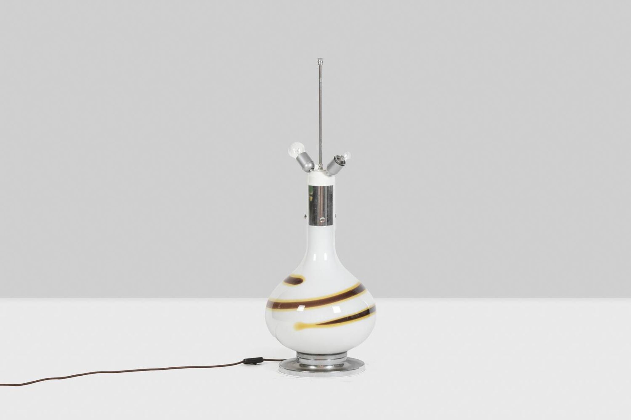 White glass lamp decorated with a brown and yellow spiral, 1970s
