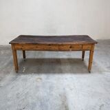 Farm table mounted on casters
