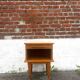 Vintage wooden bedside table / side table with tapered legs.