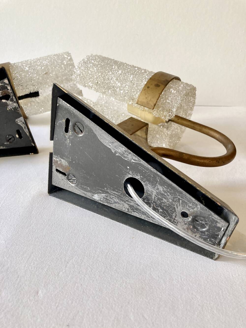 Set of three wall sconces in gold metal and ice effect Perspex, 1960-70.