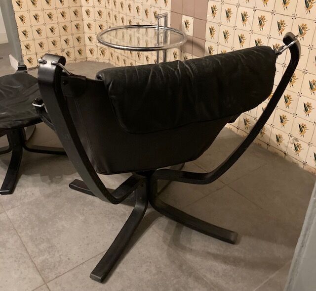 Leather Falcon armchair and footrest