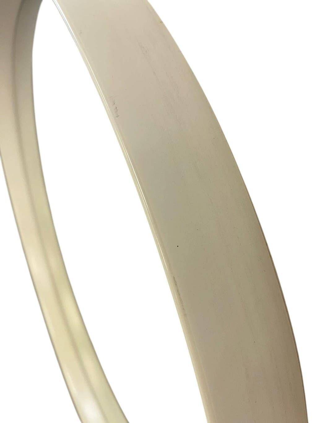 Beige vintage round mirror in a space style / wall mirror