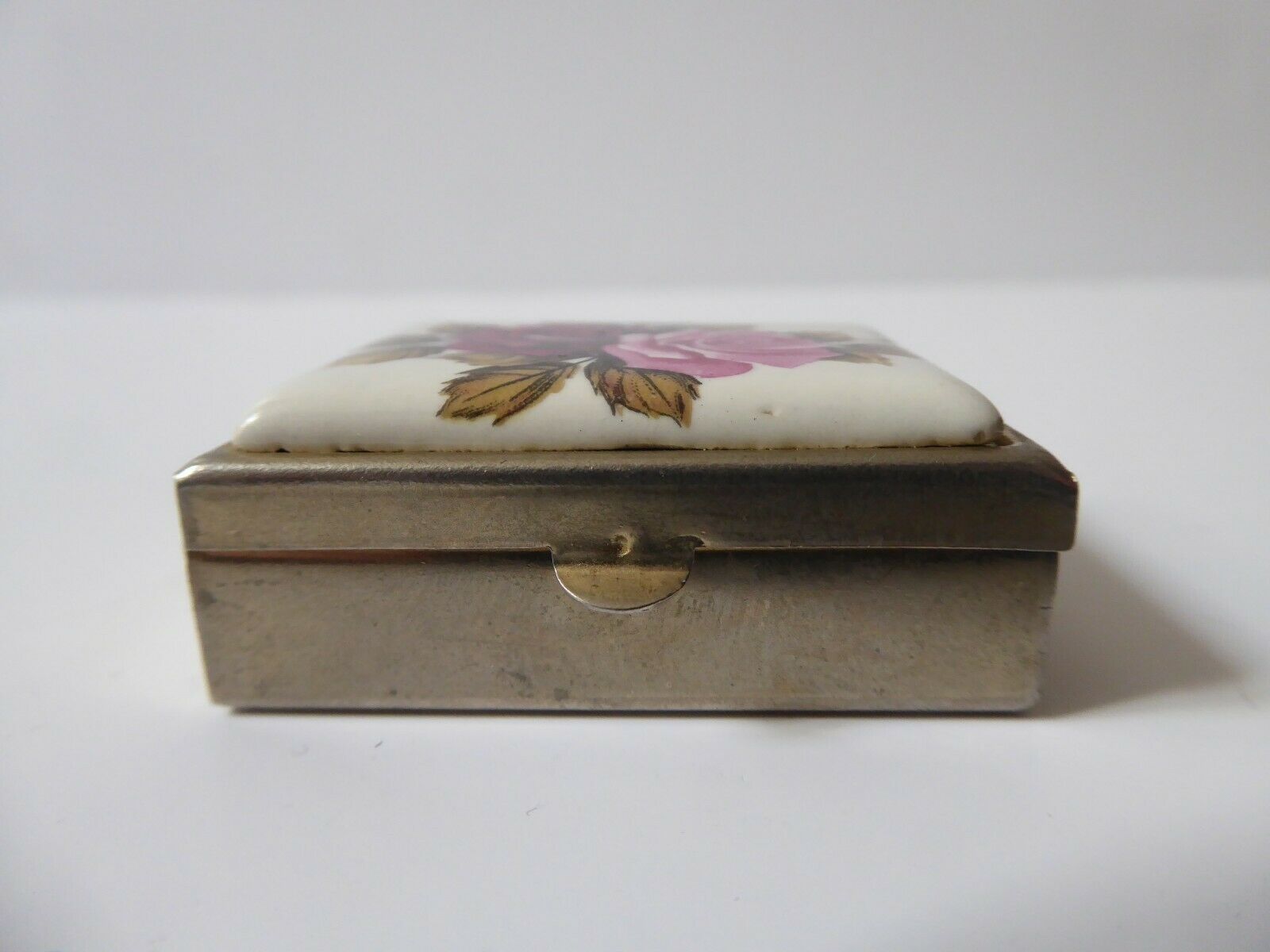 Metal and porcelain pill box roses decorations