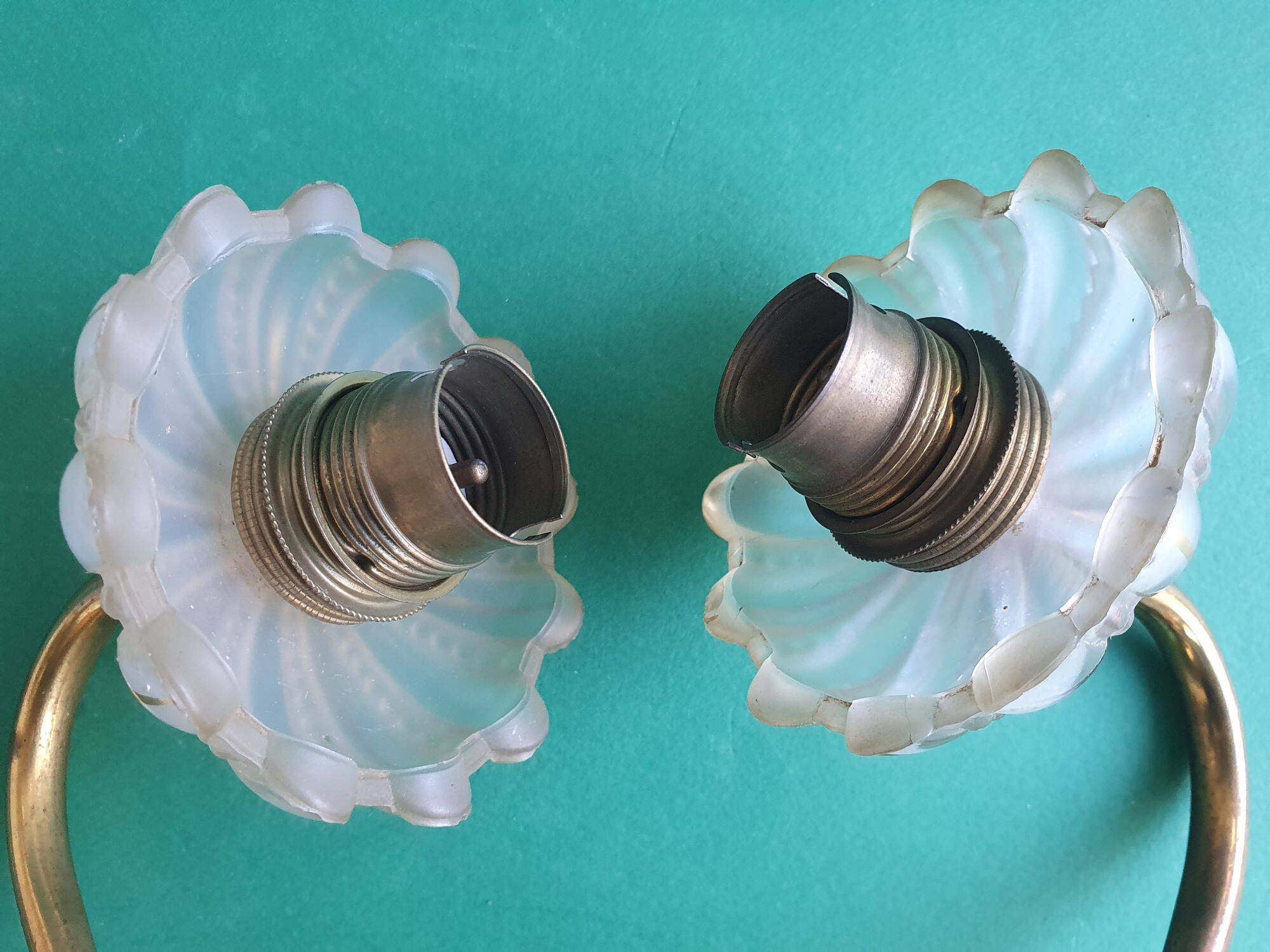 Pair of antique gold candlestick wall sconces