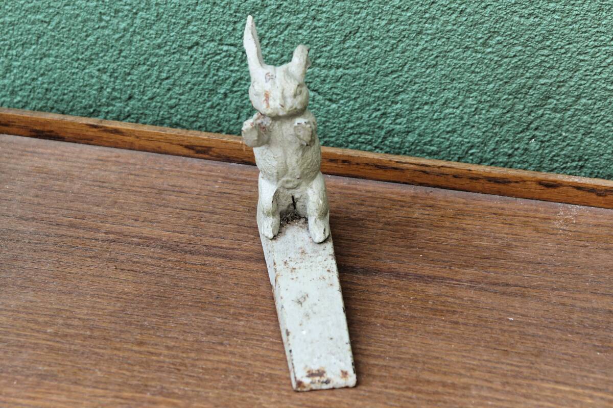 Old cast iron rabbit door wedge
