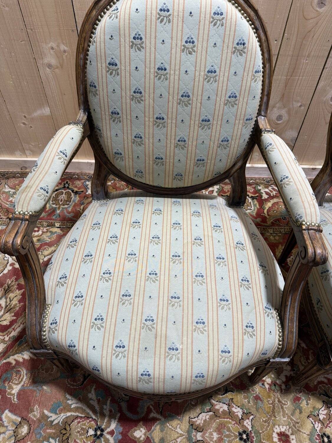 Pair of cabriole armchairs with medallion backs from the Louis XVI period, stamped OT.