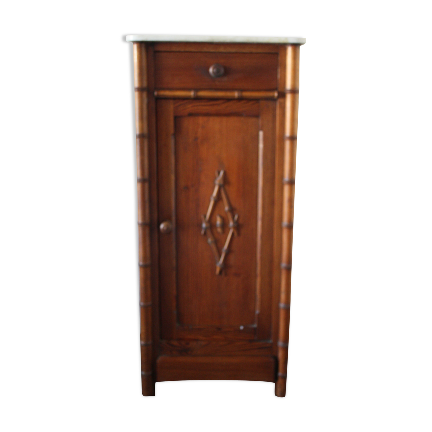 Pitchpin and bamboo beside table 1900