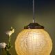 Suspension globe vintage art déco en verre dépoli jaune