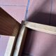 Modernist side table in wood and smoked glass
