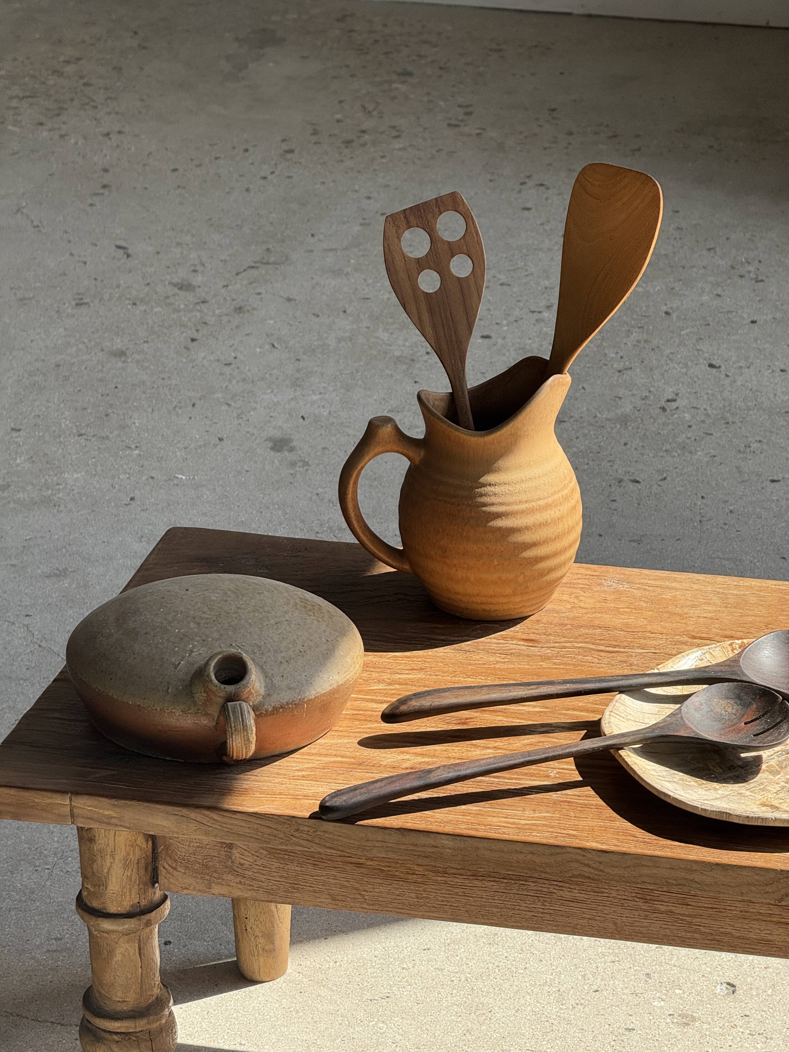 Pair of salad servers or kitchen utensils in blackened teak L30 D9