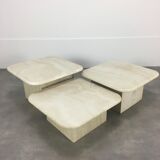 Three travertine trundle coffee tables