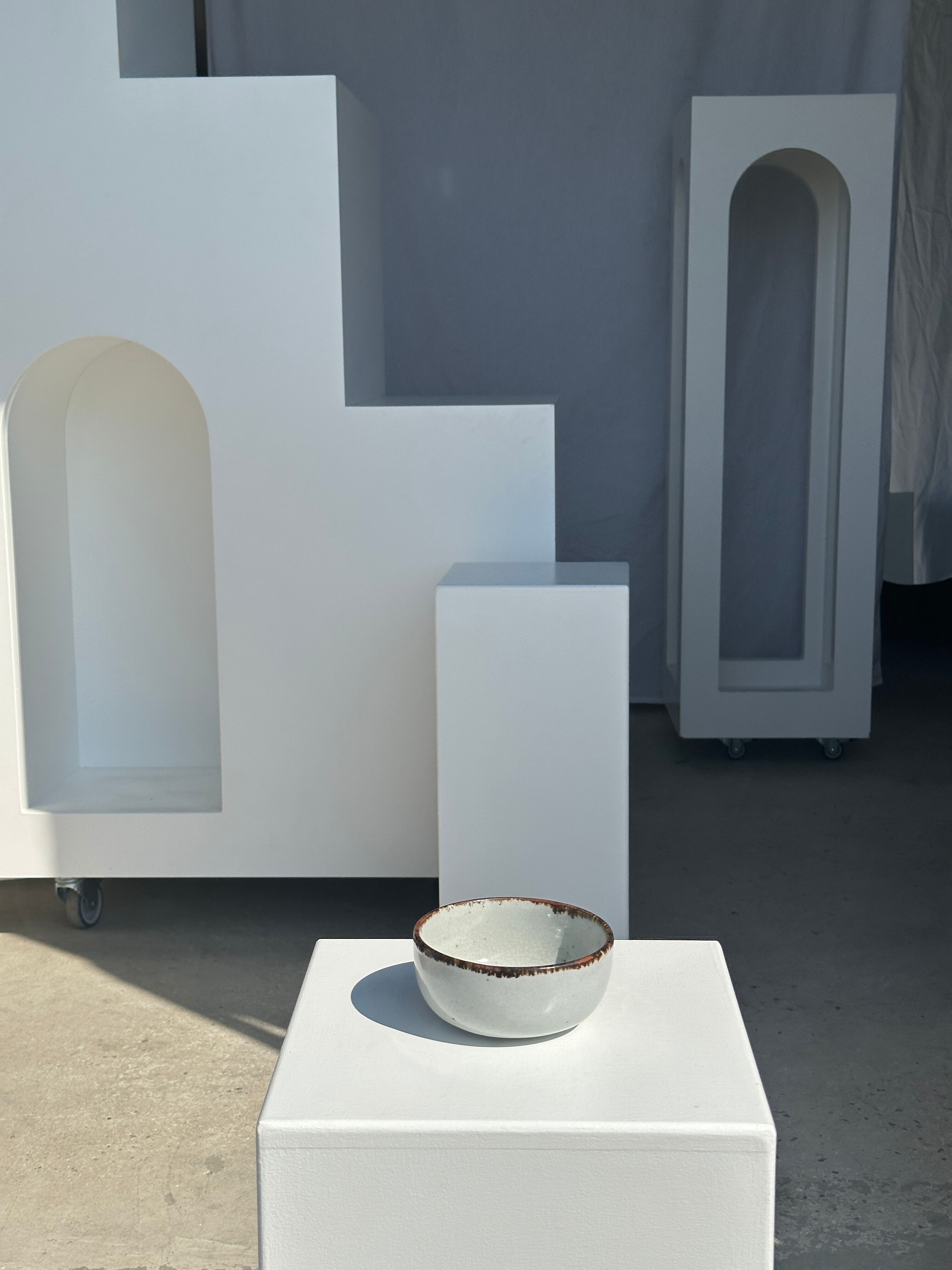 Small white glazed ceramic bowl black edges