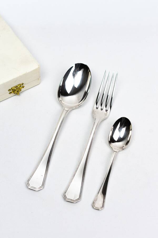 Three-piece birth set "America" — Christofle. 20th century.