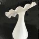 Vintage satin white glass vase with a wavy corolla