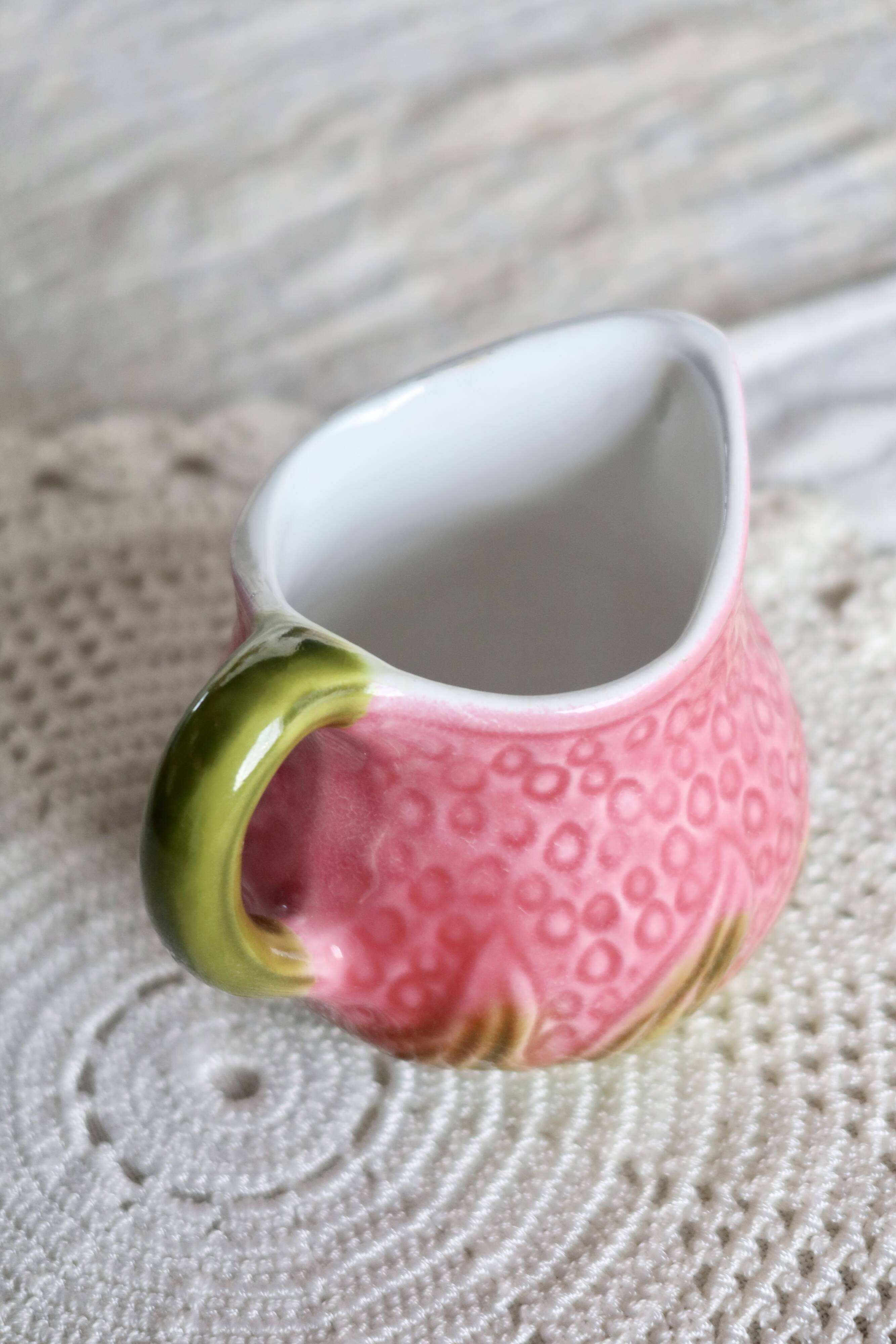 Vintage milk jug in Italian faience majolica.