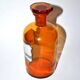 Old apothecary bottle Glass pharmacy bottle with enameled label
