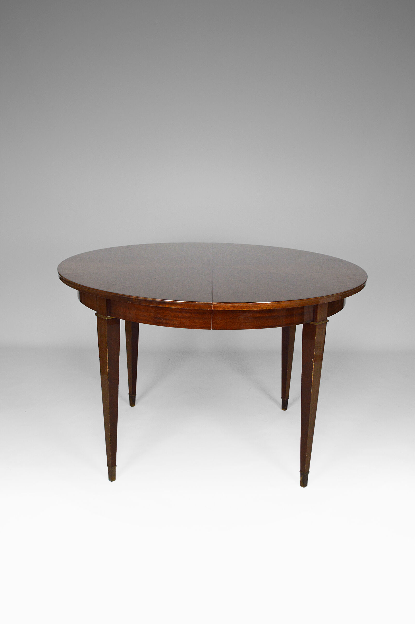 Art Deco mahogany round table by Jacques Adnet around 1940