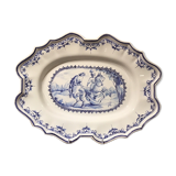 Oval plat in earthenware decorated with a hunting scene signed