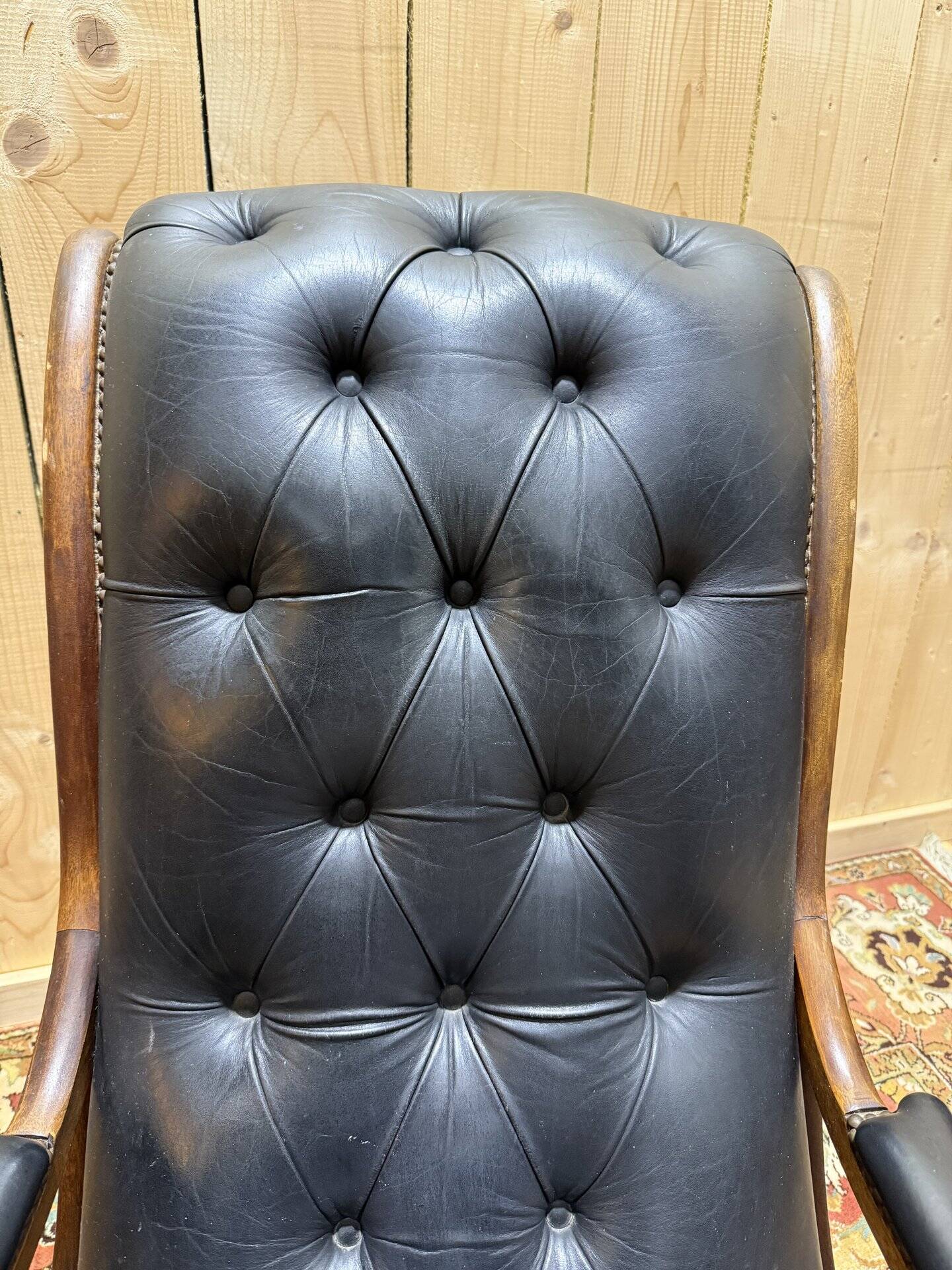 Pair of English Chesterfield armchairs in black leather