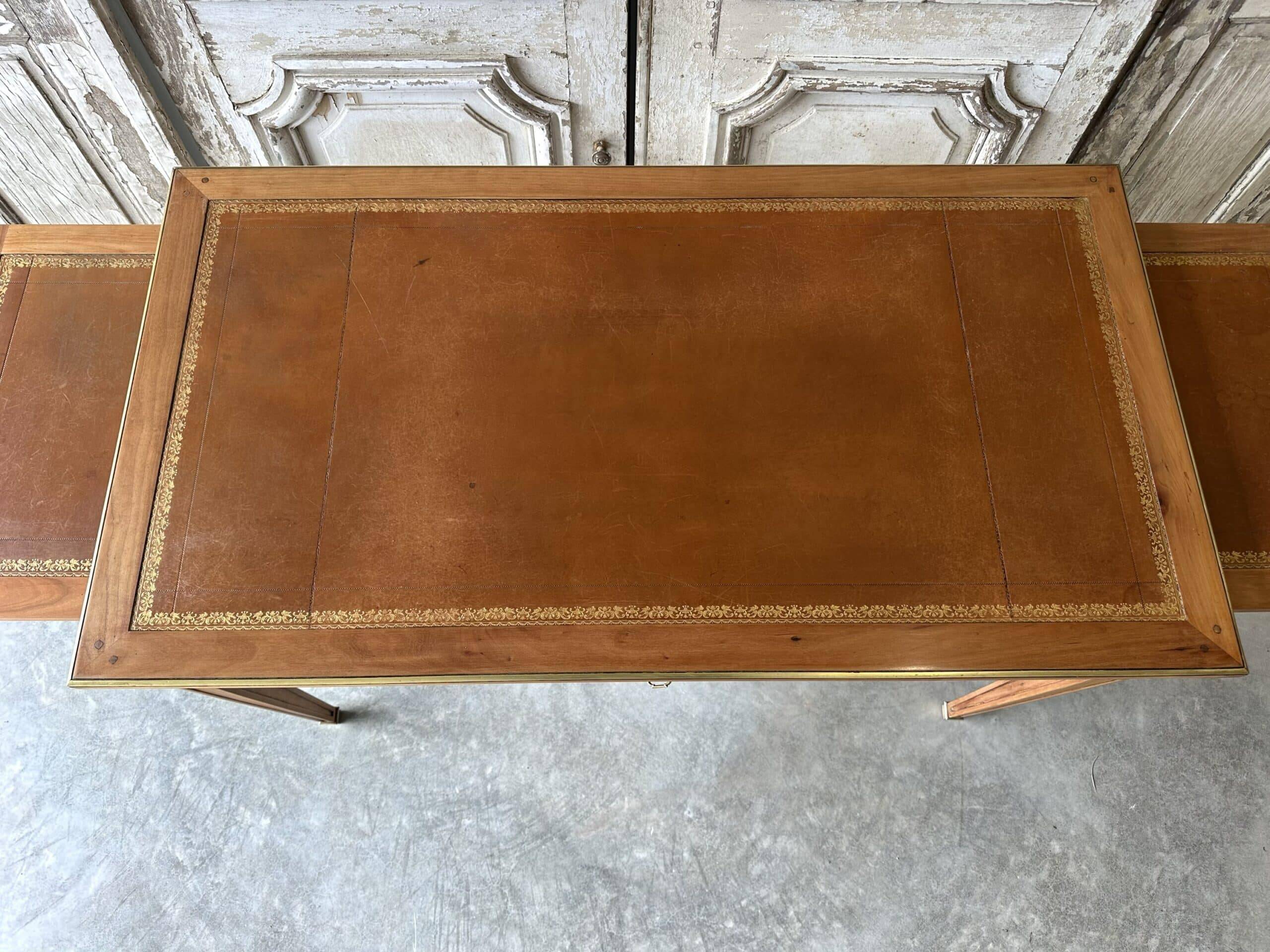 Directoire style flat desk circa 1960 in light cherry wood.