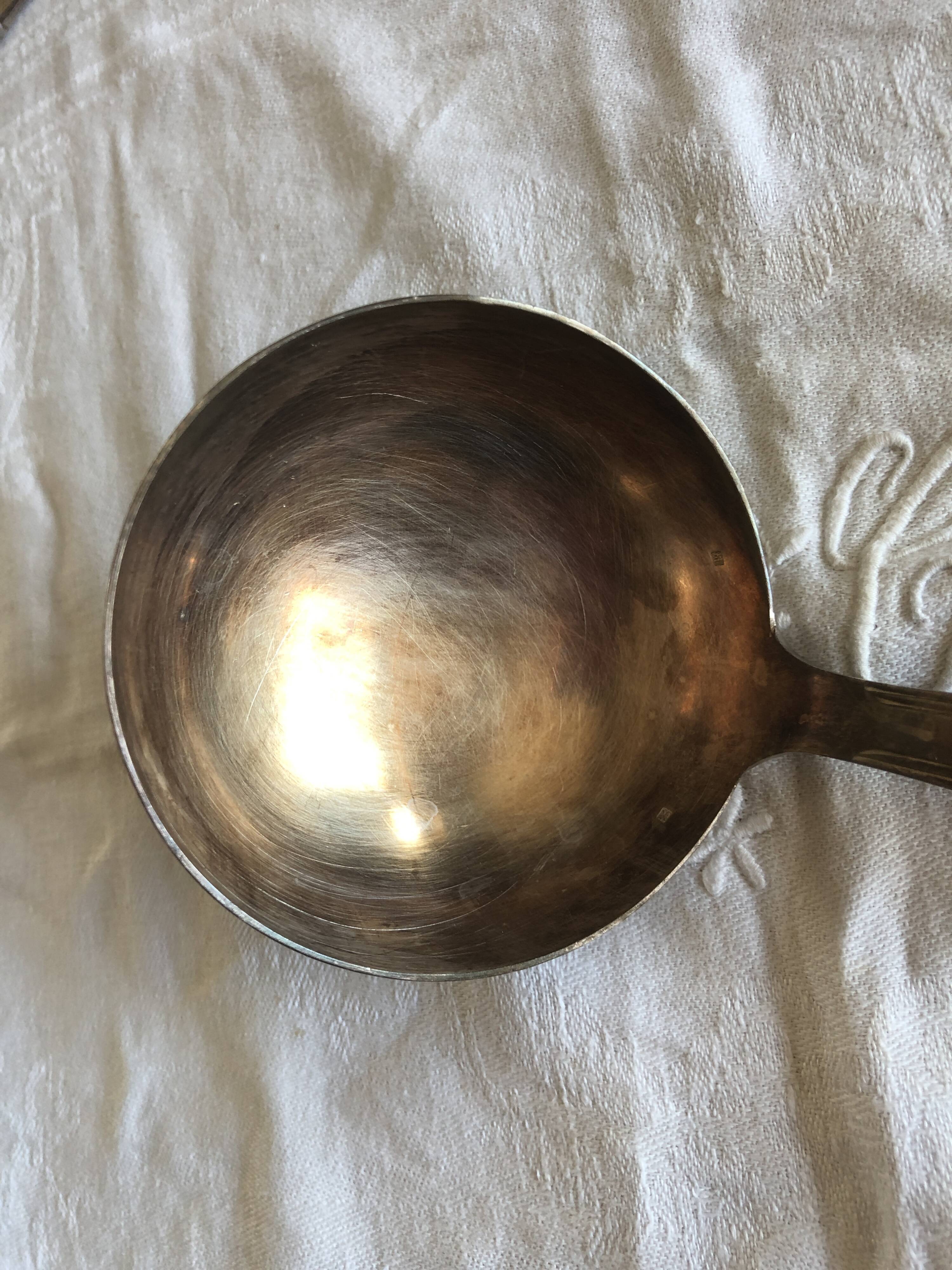 Large silver ladle