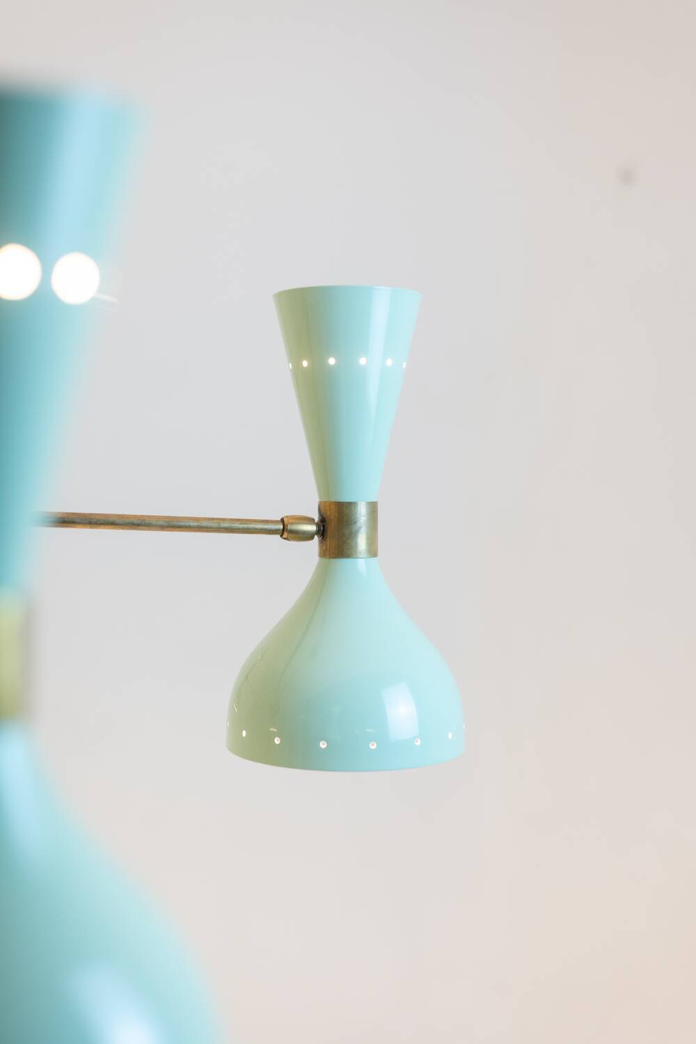 Contemporary 12-light diabolo-shaped radiant chandelier.