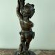 Candelabra with cherub in patinated bronze