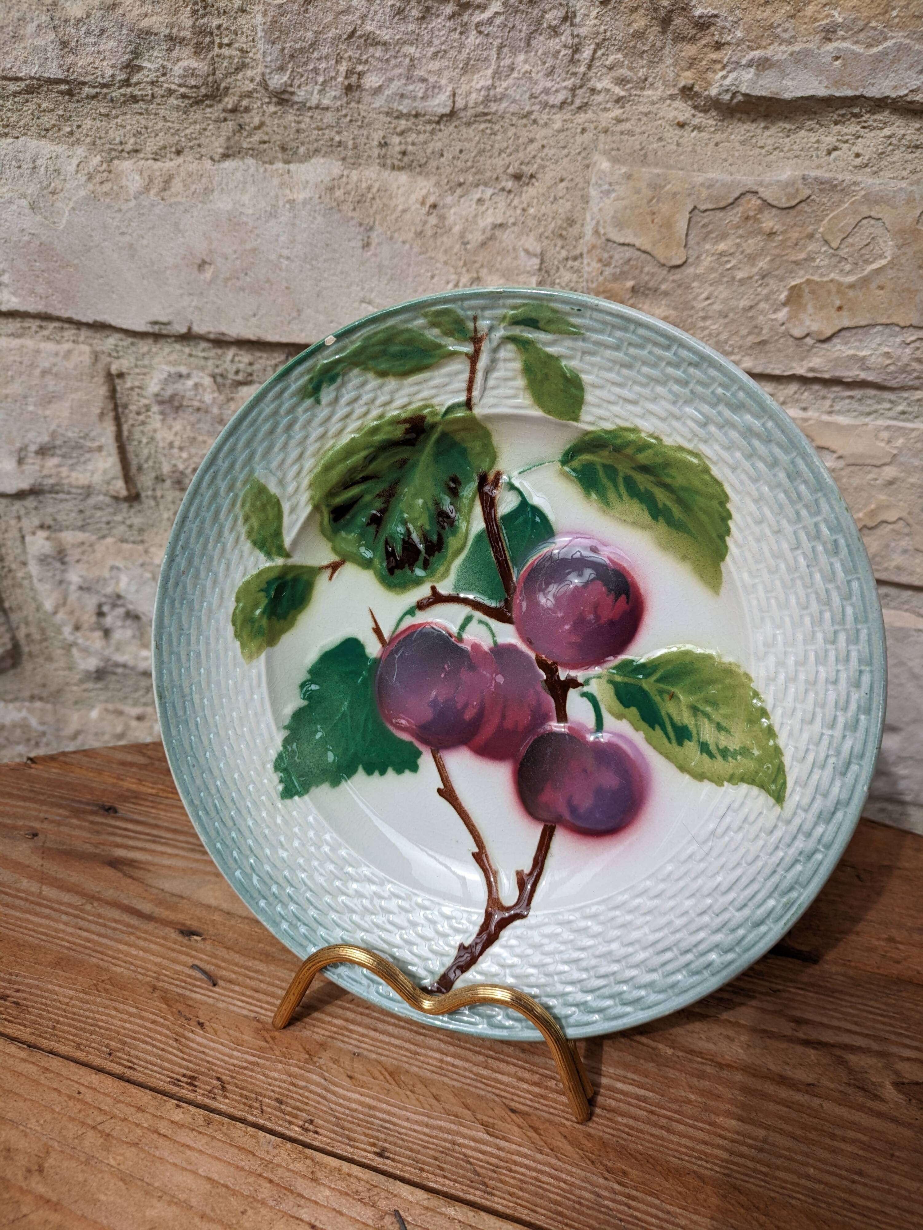 Old barbotine plate with plum motif Saint Amand Hamage