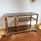 Service table with vintage brass wheels / smoked glass