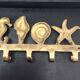 Coat rack or towel rack vintage bronze shells