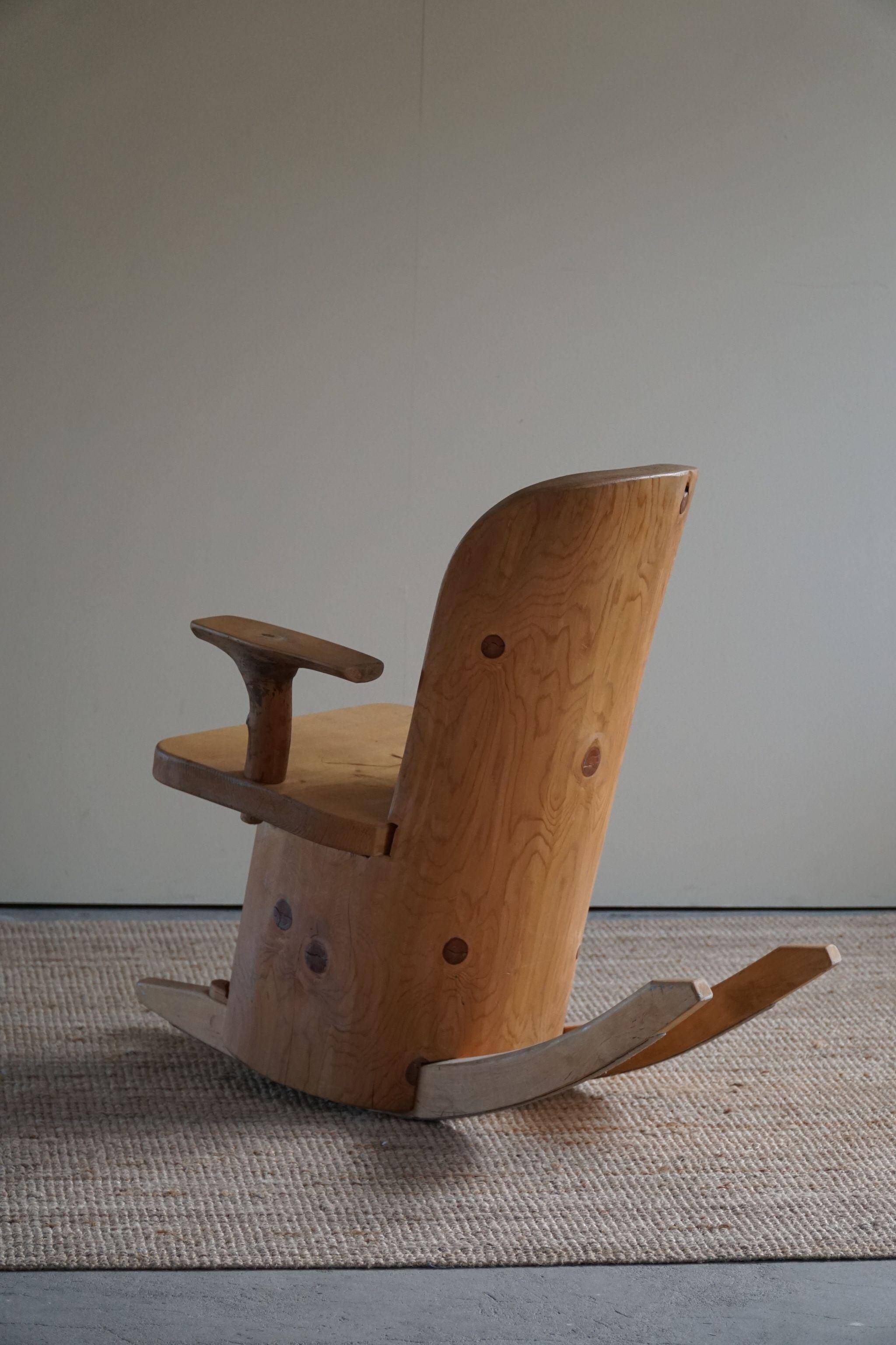 Unique sculptural rocking chair by the Finnish Matti Martikka in solid pine, 1960s.
