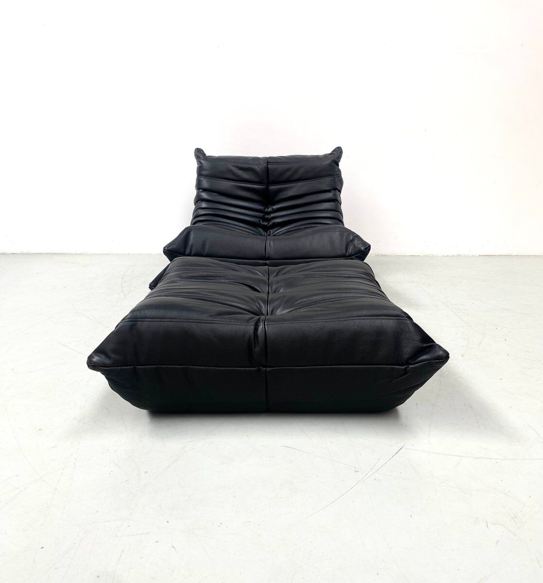 Togo chair and pouffe-black leather attributed to Ducaroy for Ligne Roset.