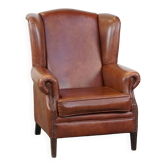Cognac-colored cowhide wingback chair