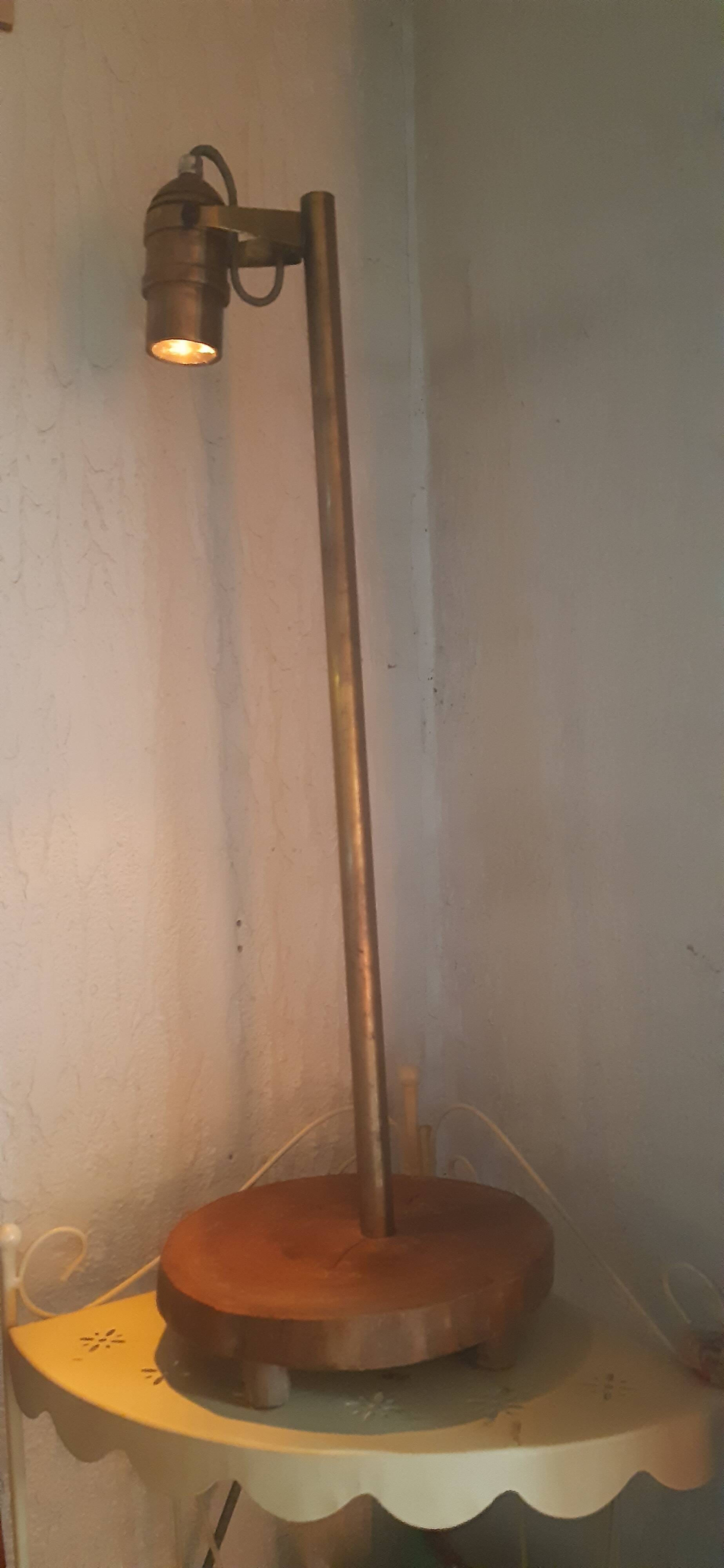 Bronze boat lamp on wooden base