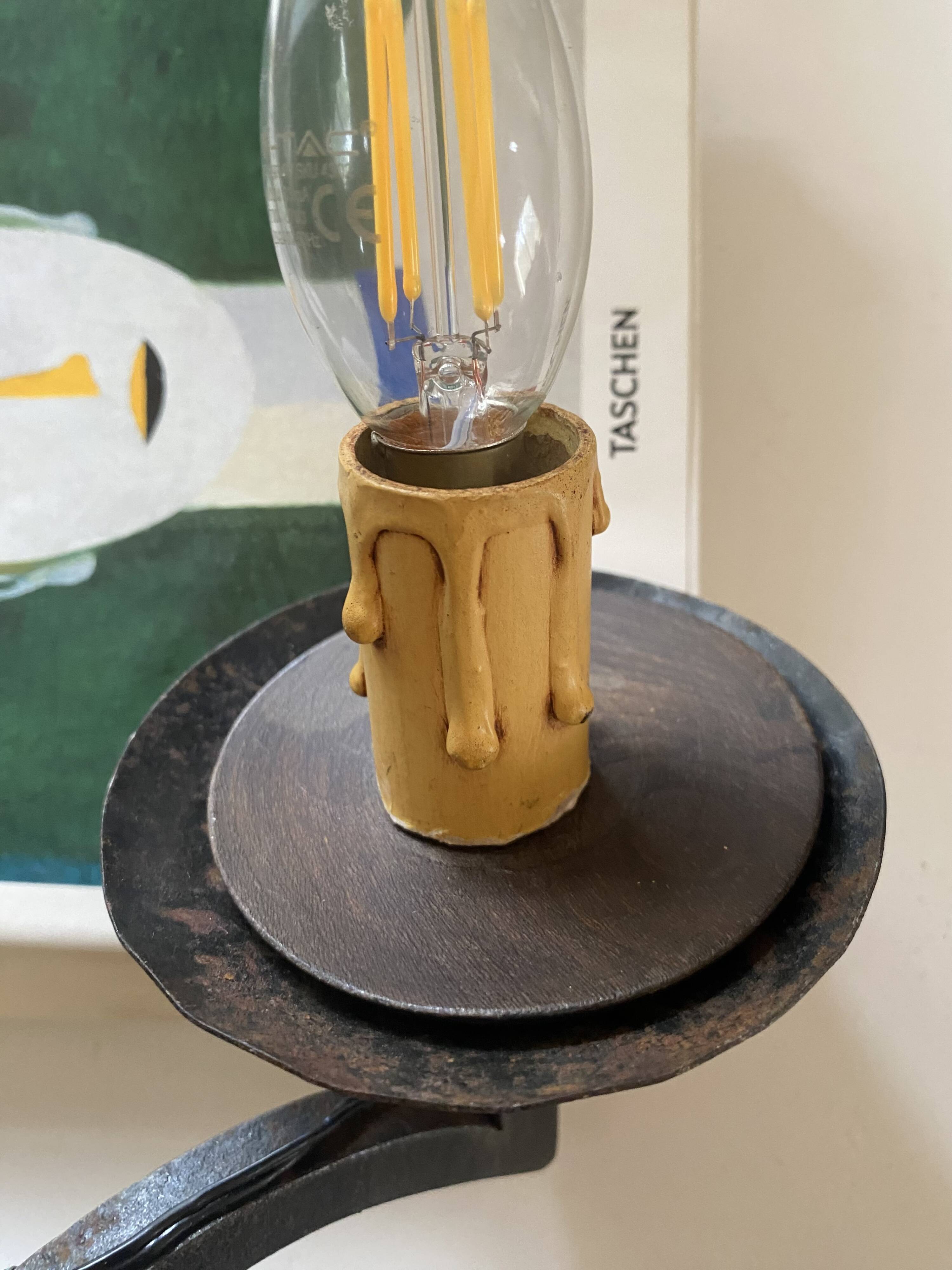 Wrought iron wall lights.