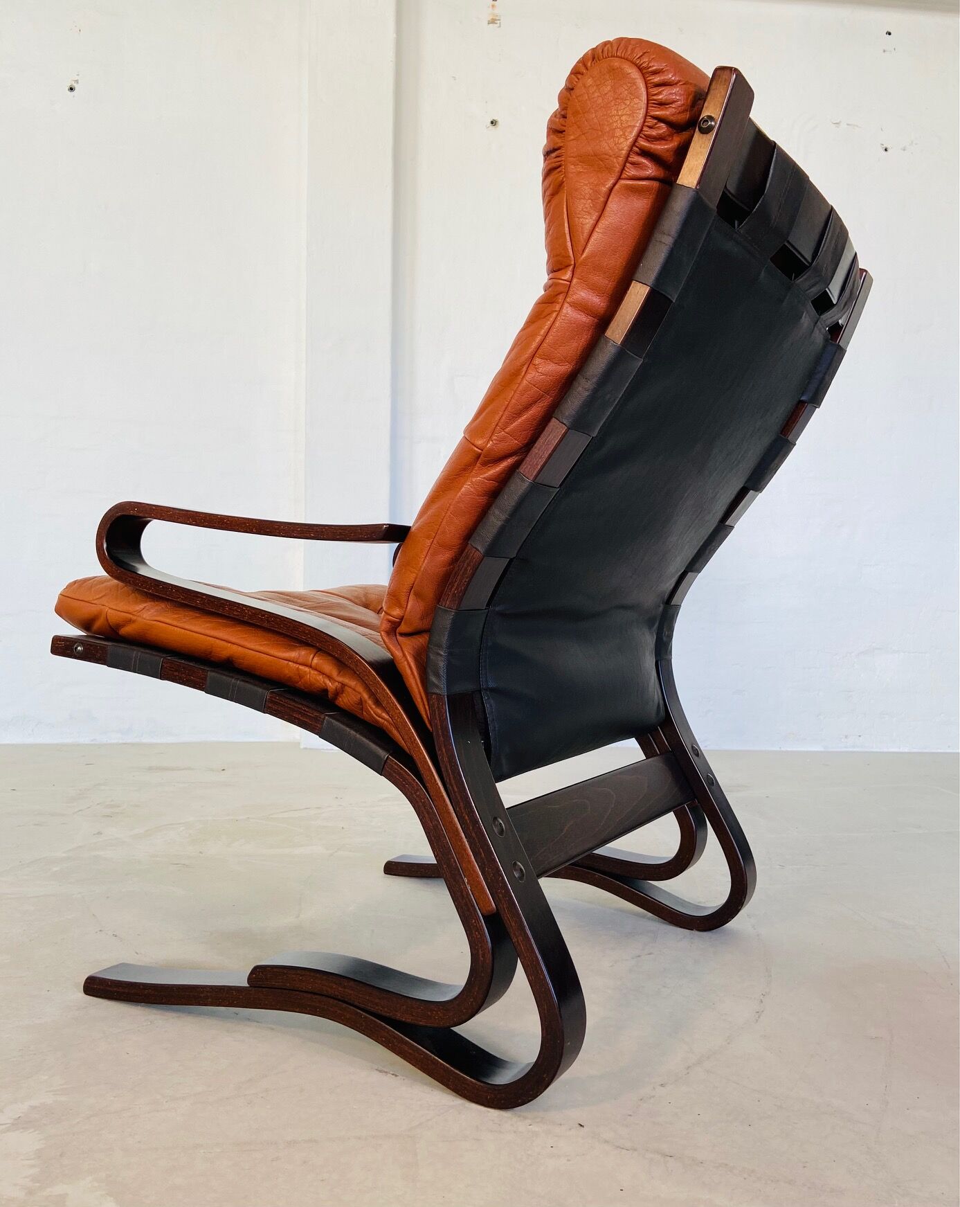 Vintage Scandinavian cognac lounge chair by Oddvin Rykken