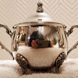 Silver-plated coffee and tea service including a coffee pot, a teapot, and a sugar bowl.