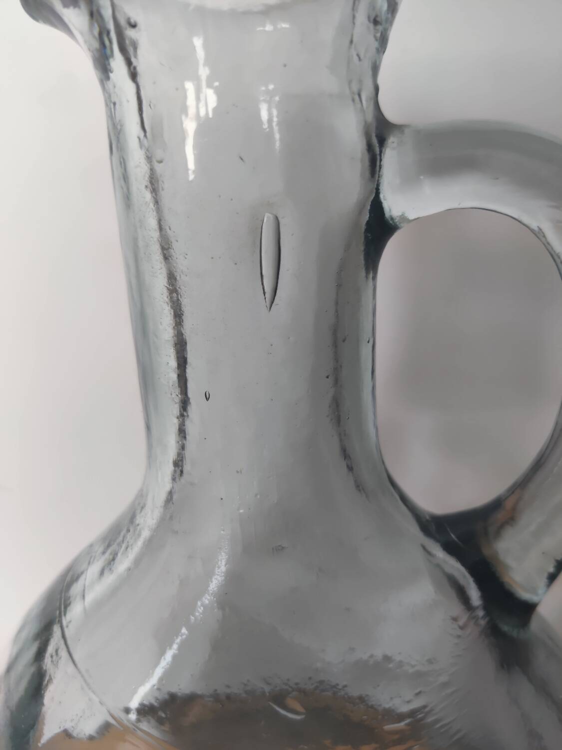 Antique carafe made of thick glass