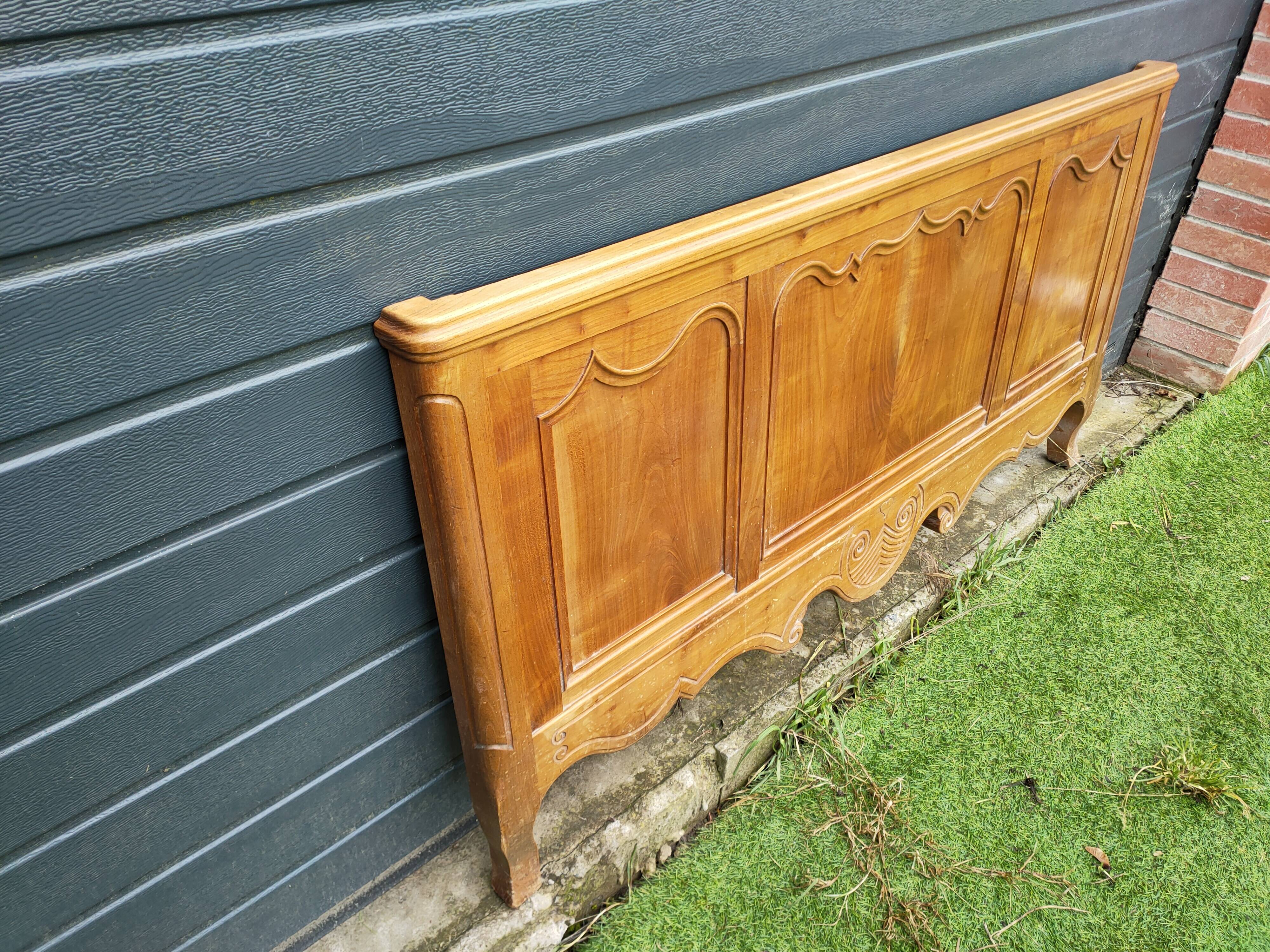 antique headboard in cherry wood