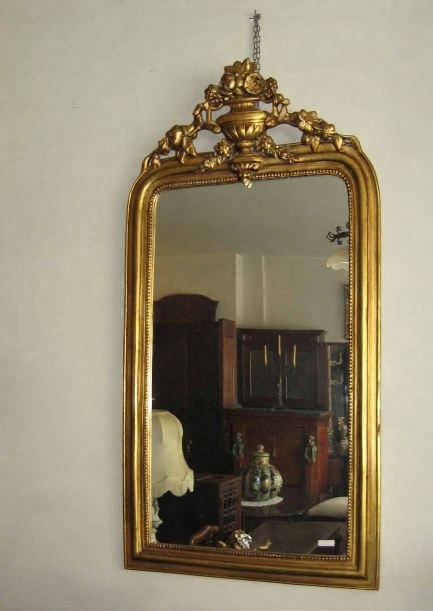 Gold wall mirror from the early 20th century.
