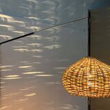 Mid-century modern Danish extendable cantilever wall lamp with a rattan shade, 1960s.