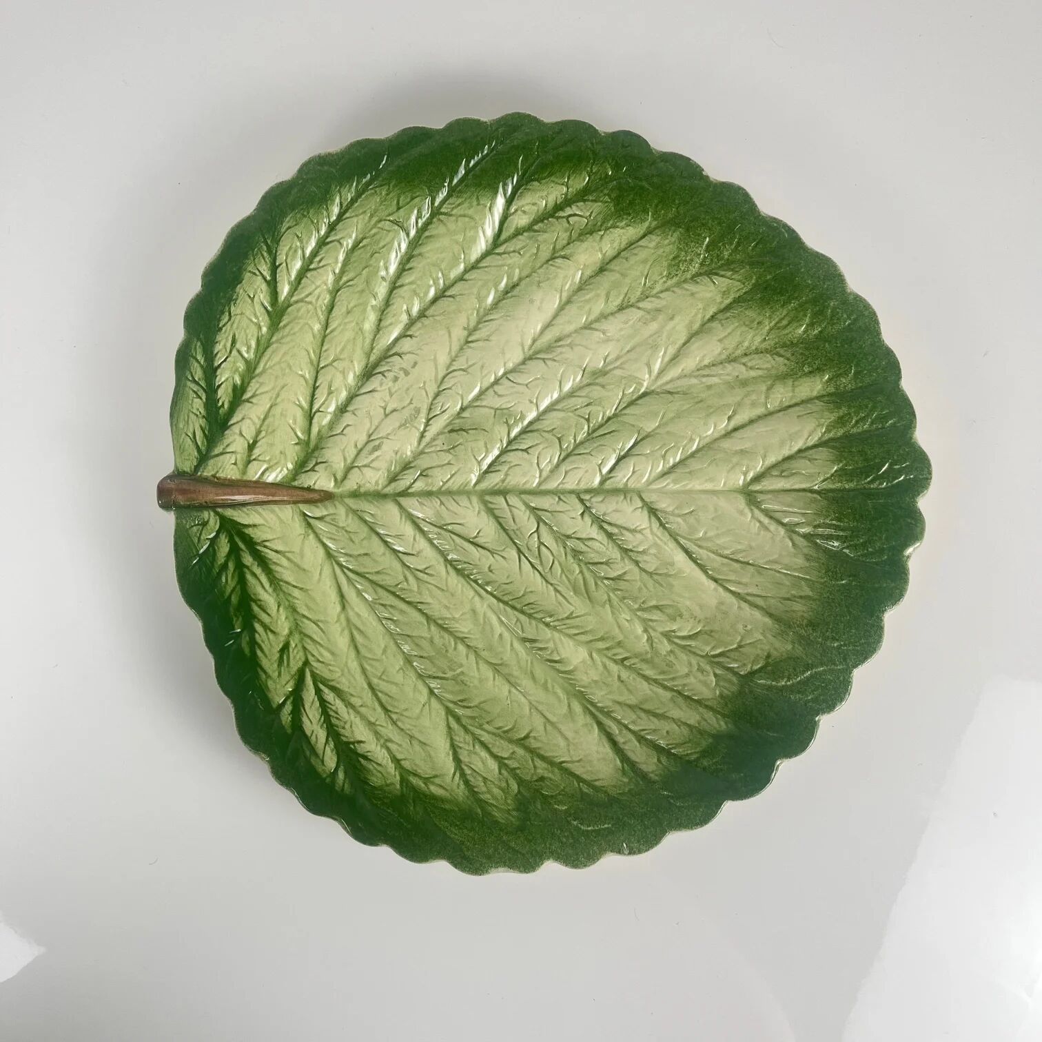 Leaf and strawberry-shaped bowl/strainer.