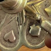 Handheld candlestick in bronze, card game decoration