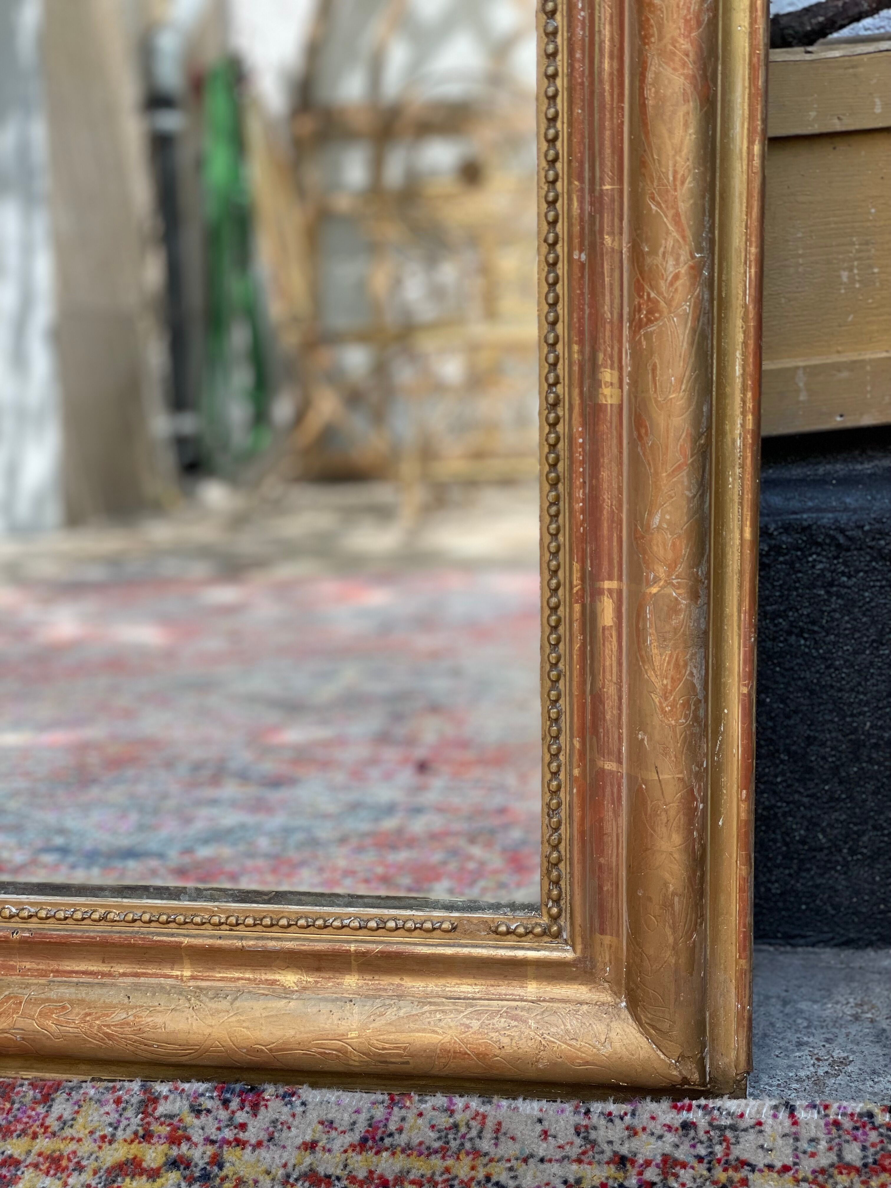 Antique mirror gilded with gold leaf (153x83)