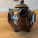 Brown ceramic teapot