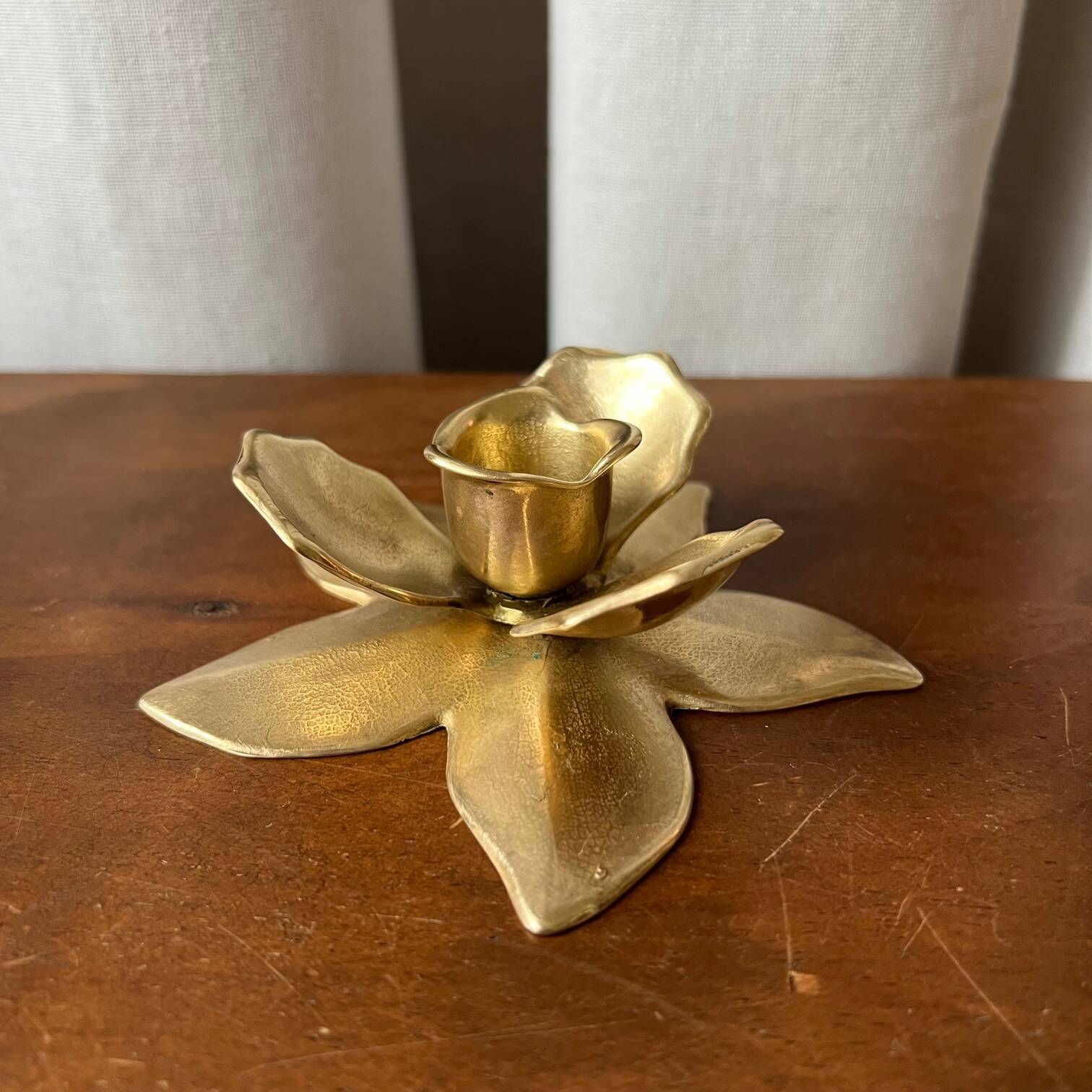 Small brass “flower” candle holder