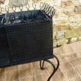 Black perforated metal planter from the 1950s