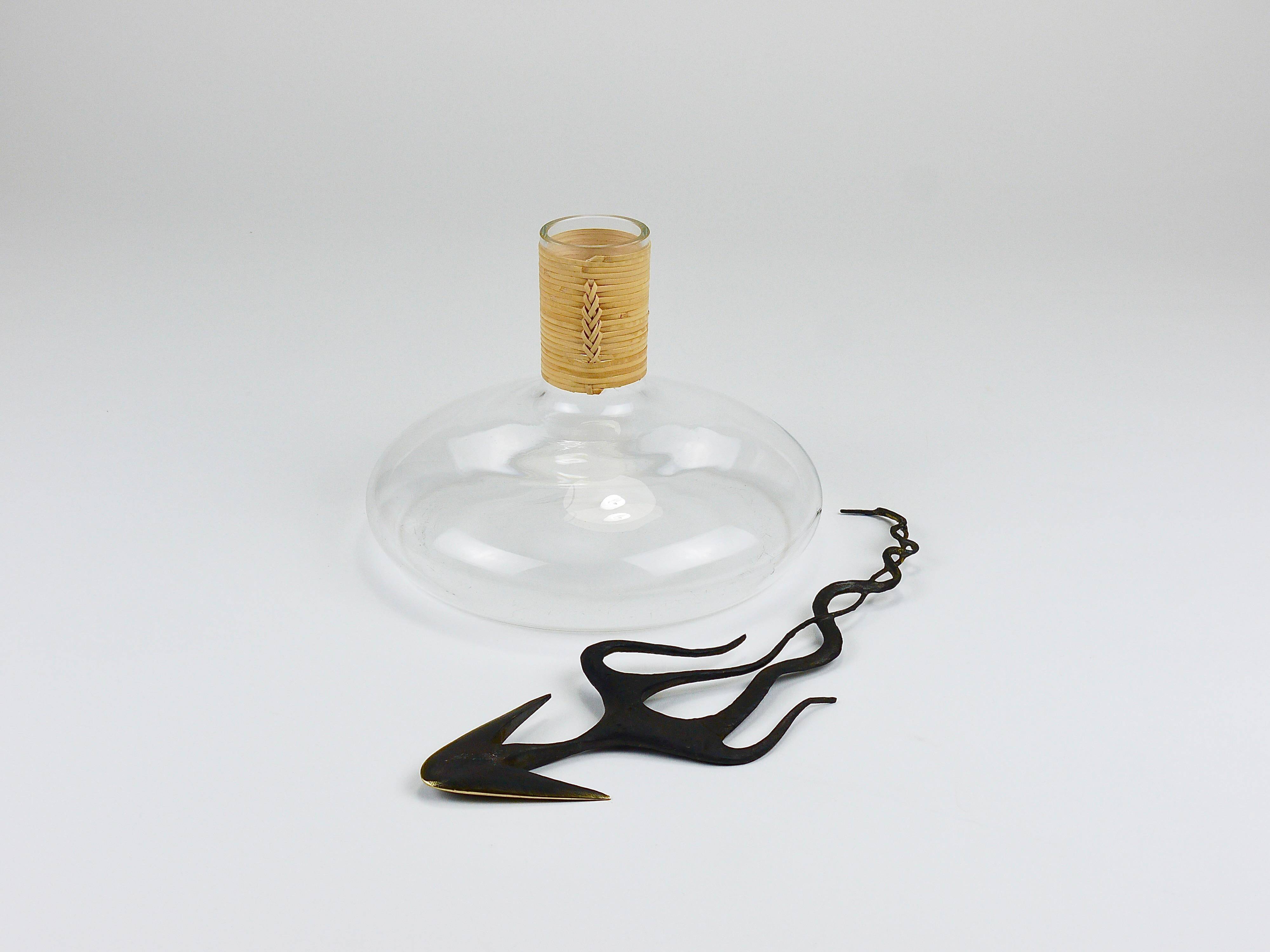 Vase by Carl Auböck decanter "Tuberkulinkolben" tall in rattan, Austria, 1950s.