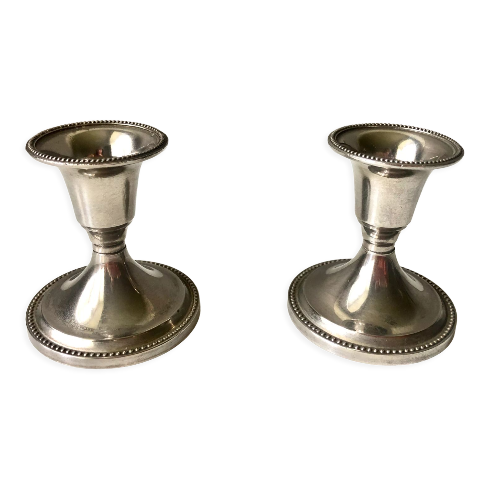 Pair of silver metal candle holders